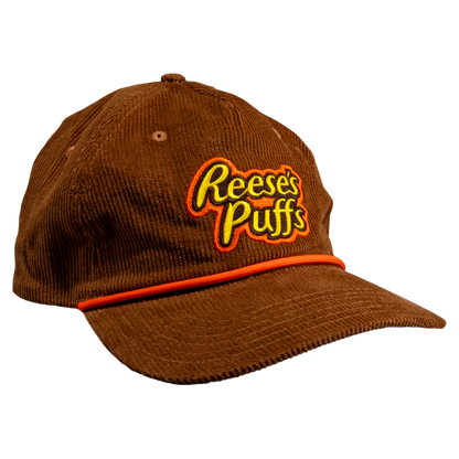 Brown corduroy rope cap with Reese's Puffs logo on the front.