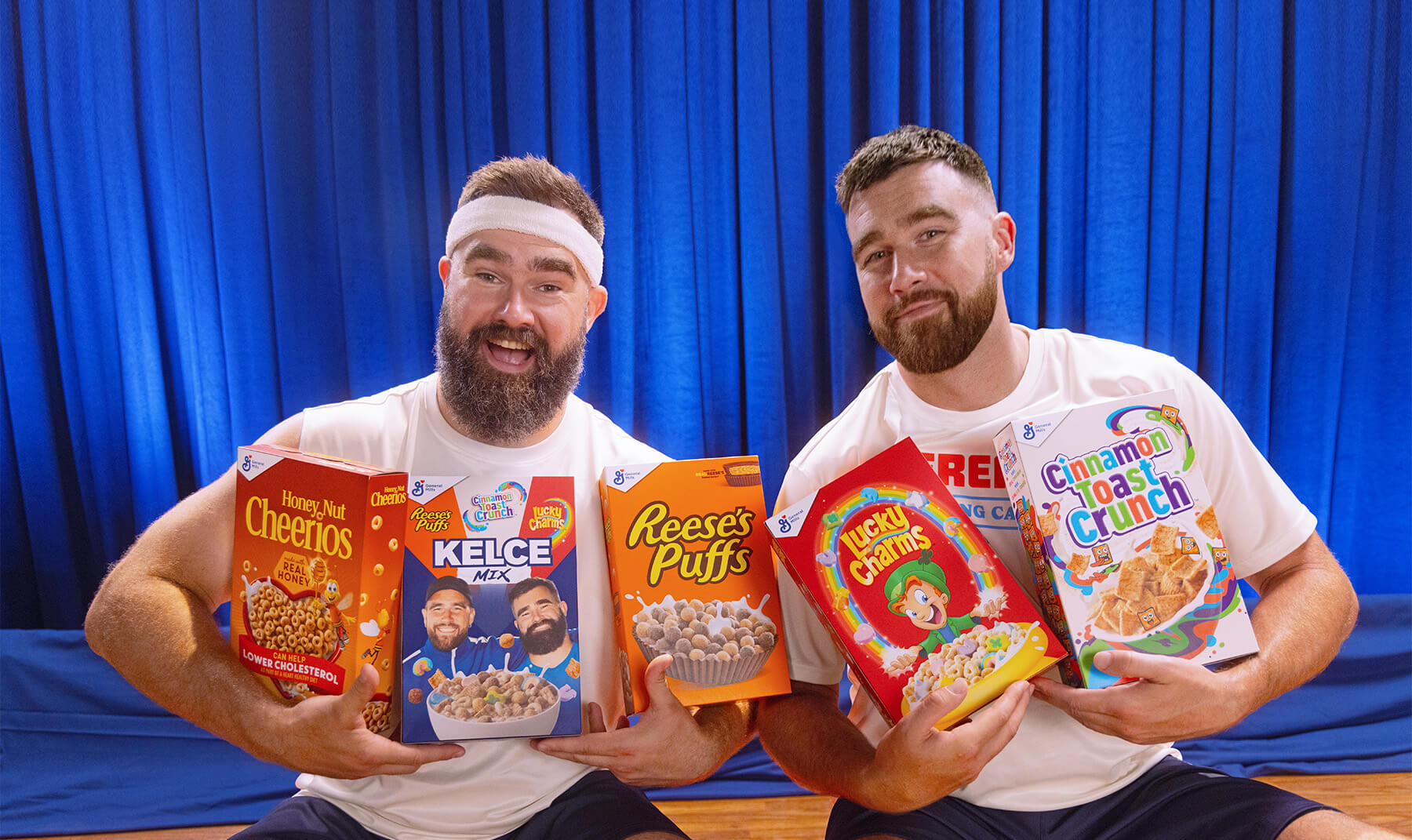 Jason Kelce and Travis Kelce holding boxes of General Mills cereal, including their own Kelce Mix.